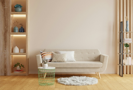 cream sofa in a living room with wooden floor and furniture